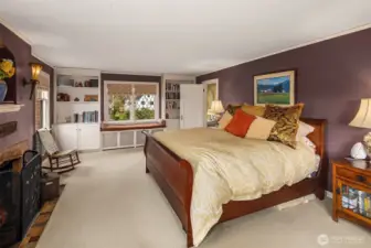 Primary suite with fireplace and views of  Portage Bay