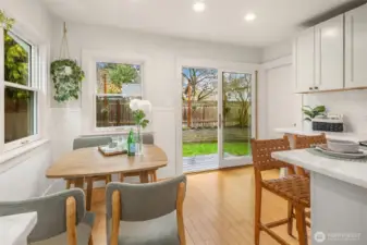 Easy access to the backyard and basement.  Notice the new double pane windows and sliding door