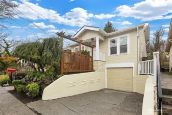 large driveway for easy off street parking, notice the earthquake retrofitting plates on the retaining wall