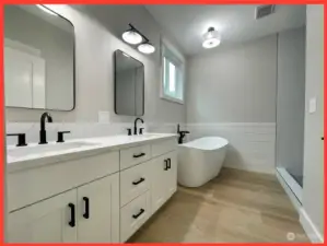 Spacious 4-piece bathroom with double sink vanity.
