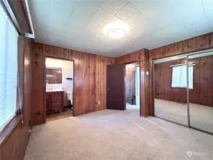 Primary bedroom with private half bath