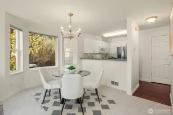 Open kitchen dining with views of nature.