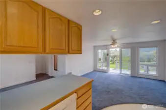 Apartment living, kitchen and dining area. The sliding door takes you to the rear deck and fully fenced, landscaped back yard.