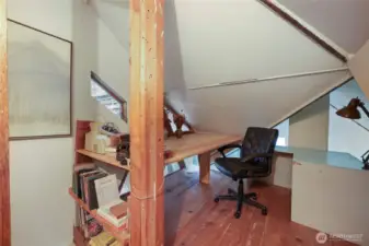 Sleeping loft doubled as office space.