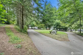Paved circular drive to home entry