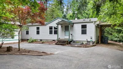 Carport and shed by front entry with lots of room for parking