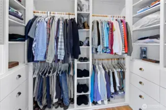 The spacious well organized primary bedroom closet.