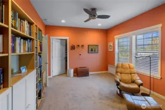 Guest bedroom with large walk-in closet/storage. Bookcases will remain with the home.