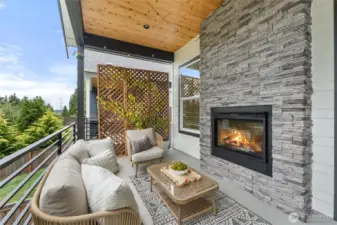 Outdoor covered deck with fireplace