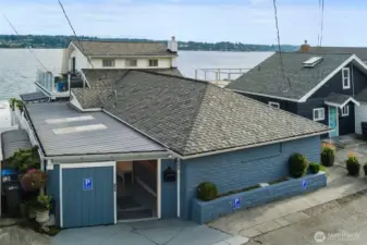 Front of home. Garage door has been removed.