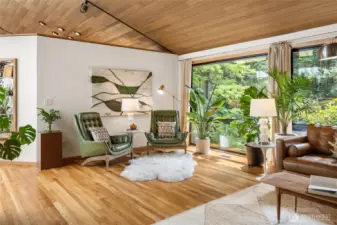 Abundant windows look out to peaceful treed views and fill every room with year-round light.