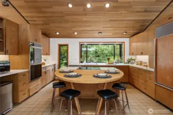 Chefs will delight in the incredible kitchen, outfitted with an induction cooktop, new quartz counters, double ovens, refinished original cabinetry, and tons of storage.