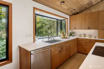 Doing dishes won't feel like a chore when you get to look out to all this beautiful greenery!