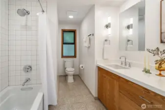 Full bathroom on the main level is great for guests, and also boasts heated floors.