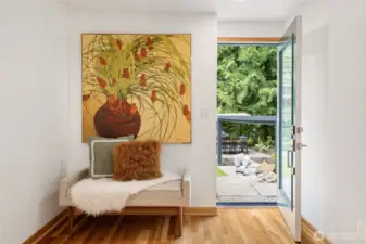 This cozy nook is the perfect sitting area, with a door leading out to your backyard oasis.