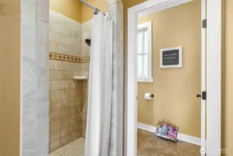 High end tiled shower and floors.