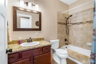 Cast iron tub with luxury tile surround. Main house