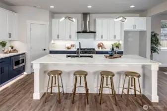 Large island in kitchen with built in breakfast bar