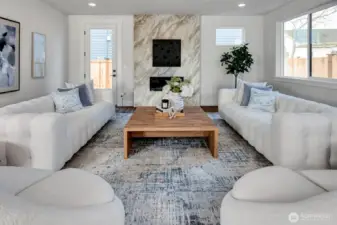 Bright room with easy, comfortable flow. Door opens to side yard.