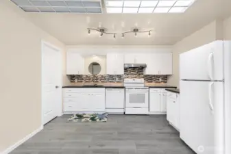 Spacious kitchen in the lower unit featuring plenty of storage.