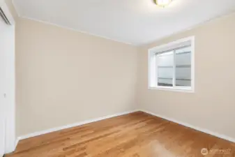 Lower Unit bedroom #3 also featuring hardwood flooring.