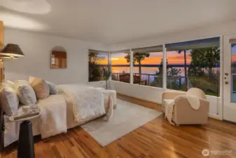 Watch the eagles fly and endless horizon of water, mountains and sky from your primary bedroom.