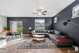 Open-concept living space with 9’ ceilings, luxury plank flooring, and abundant natural light.