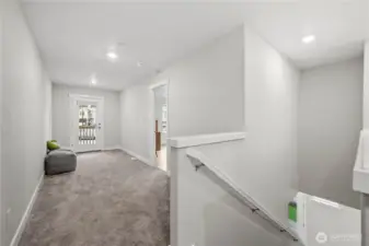 Versatile loft space ideal for a home office, media room, or cozy reading retreat.