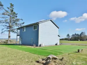 Rear and West side of the house with some turf grass for the yard.