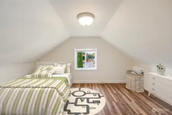 Upstairs, you’ll find two additional bedrooms, each filled with natural light and charm.