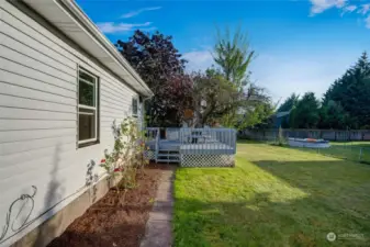 This outdoor haven is perfect for enjoying the beauty of nature in privacy, thanks to the mature trees that line the property, offering both shade and seclusion.