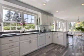 Oh, all those windows brings the outdoors in.  This kitchen is a pleasure to spend time in.
