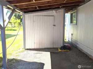 Storage buildings under carports