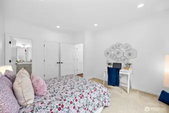 The main floor bedroom is located away from the living areas for privacy and has an en-suite bathroom.