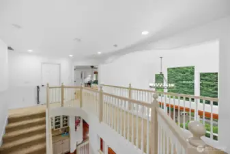 Elegant imperial staircase allows access from either the kitchen or front entrance.