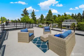 Expansive rooftop deck delivers big-sky vibes and room for outdoor living zones. Photos are of model home 8825, finishes and floorplan may vary.