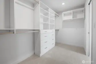 Walk-in closet with built-ins keeps wardrobes organized and mornings stress-free. Photos are of model home 8825, finishes and floorplan may vary.