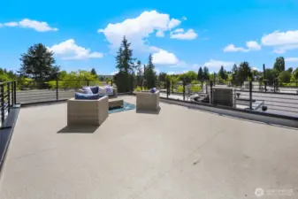 Rooftop expanse ready for lounge furniture, planters, and epic summer sunsets. Photos are of model home 8825, finishes and floorplan may vary.