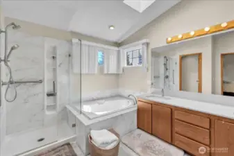 The primary bath offers a soaking tub, walk-in shower, dual vanity, private toilet, and a spacious walk-in closet.”