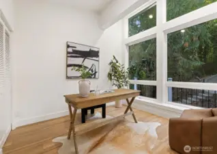 Versatile room currently staged as a home office