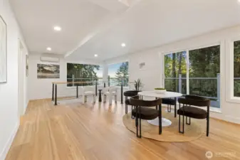 The spacious kitchen features a sunlit breakfast nook with sliding doors leading to the deck