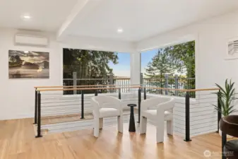 The spacious kitchen features a sunlit breakfast nook with sliding doors leading to the deck