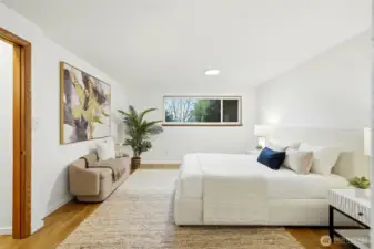 Primary bedroom with neutral tones and comfortable layout.