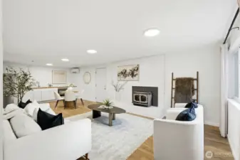 Spacious lower-level living area with fireplace, perfect for a bonus room or potential MIL suite in this Kent home.