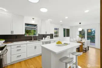 Bright kitchen with breakfast nook and easy access to outdoor entertaining areas.