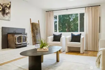 Cozy lower-level living area with natural light and comfortable seating space.