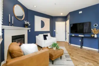 Vaulted ceilings make this space feel open. Beautiful laminate plank floors.