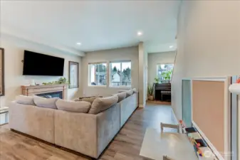 Great room has a nook for a desk, bench or piano, and access to a balcony for enjoying the weather or Barbequing.