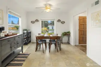 The kitchen opens into a dedicated dining room area.
