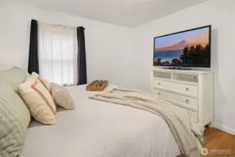 This primary bedroom fits a king size bed.